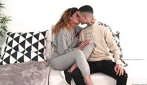 Inked guy copulates his curly-haired GF upon the spirited room