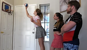 A ribbon indoor basketball game with two hot gals