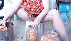A milf in the kitchen does housework subjugated